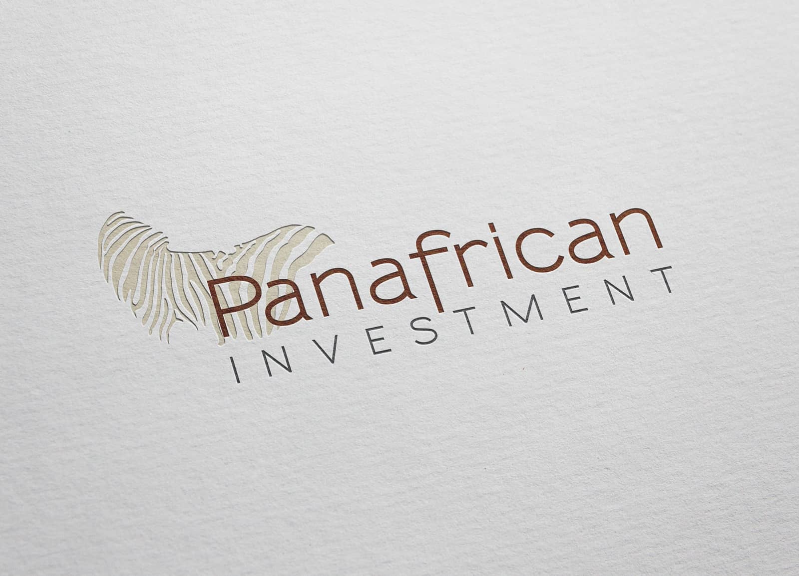 Logotipo Panafrican marrón sobre fondo de papel branding por The Acctitude diseño web